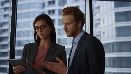 Business People Using Tablet Computer in Office