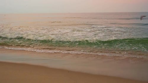 Blue water ocean wave blue swells crashing curling breaking a wavy surface close up