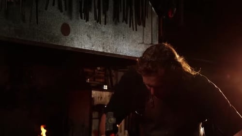 Blacksmith working on a iron rod
