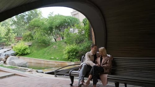 Young Attractive Couple in Love, Man and Woman, Hugging While on a Date, Walking in the Park