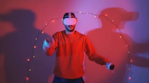 Man Wearing VR Headset Interacting with Virtual World