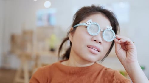 Young Woman Wearing Medical Trial Frame Glasses