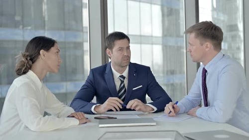 Team Having a Meeting in an Office Building