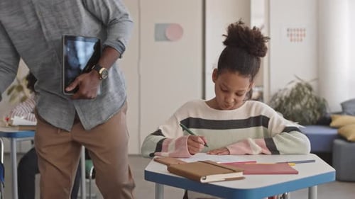 Afro American School Teacher during Class