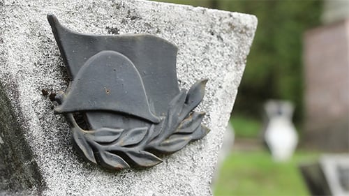 Worn Grave Marker Emblem Close Up