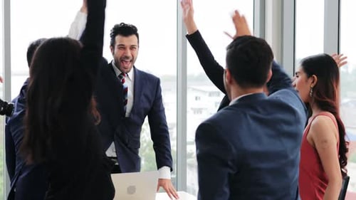 Diverse Business Team Celebrating Success Together in Office