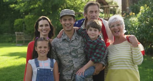 Cheerful Family Portrait with Soldier in Backyard