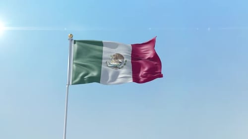 Mexican Flag Waving in the Wind with Blue Sky