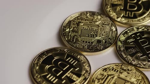 Rotating shot of Bitcoins (digital cryptocurrency)