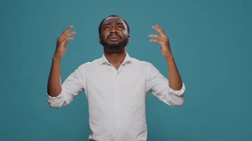 Man Looks Upward with Expressive Frustration