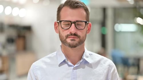 Portrait of Man in Glasses and Blue Shirt