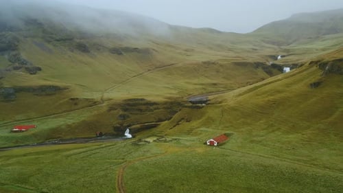 Beautiful Aerial Drone View of Icelandic Landscape with Green Fields and River in Summertime