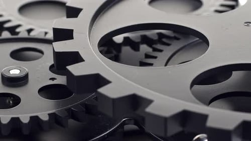 Mechanical Gears Interlock and Rotate in a Close Up
