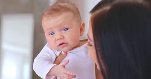 Close Up of Infant Being Held by Adult