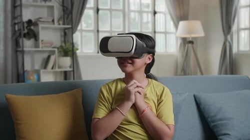 Girl Wearing VR Headset on Sofa
