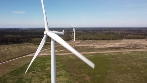 Wind Turbines Spinning in Rural Landscape