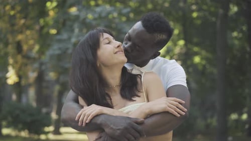 Couple Embracing in the Park Together