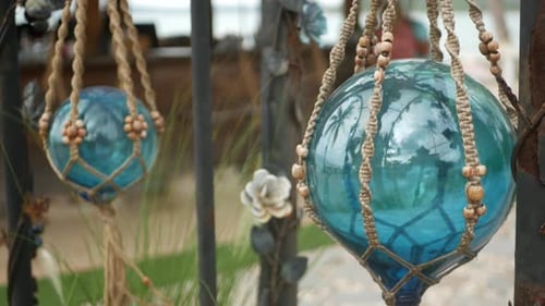 Beautiful Retro Decor and Plants for Garden. Set of Blue Sea Buoys From Glass and Macrame in Vintage