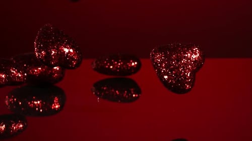 Decorations falling, bouncing in ultra slow mo 1500fps - reflective surface - VALENTINES PHANTOM 002