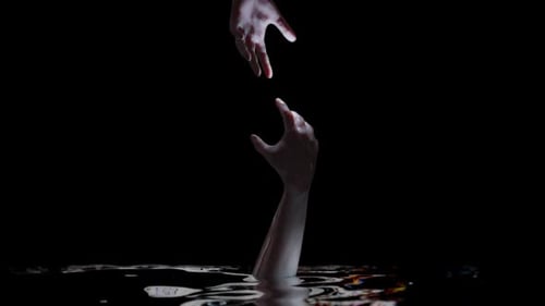 Human Hands Reach for Aid Above and Below Water