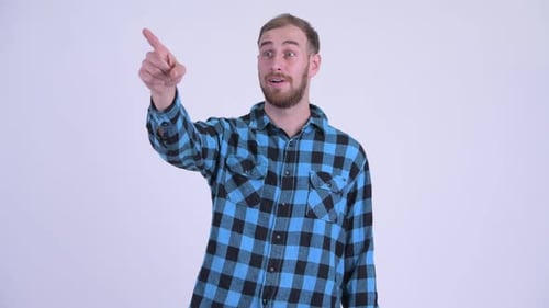 Young Adult Points and Smiles in Studio Setting