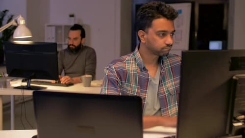 Men with Computers Working at Night Office 46