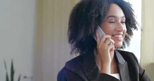 Young Woman Talking on Smartphone