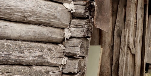Weathered Log Cabin Wall with Rustic Wooden Planks