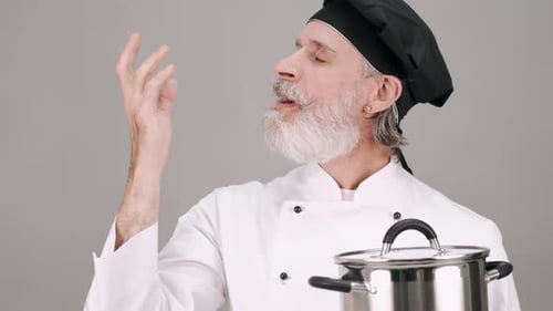 Chef Tasting Food From a Pot
