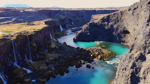 Majestic canyon with river and waterfalls