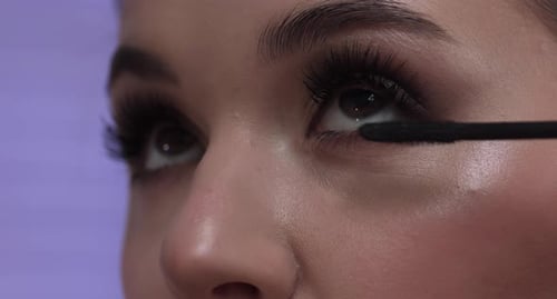 Girl Paints Eyelashes