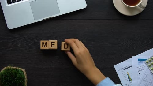 Writing Medicine on a Wooden Desk Overhead