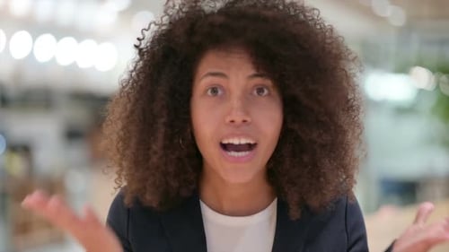 Woman Talking to Camera in Office Setting