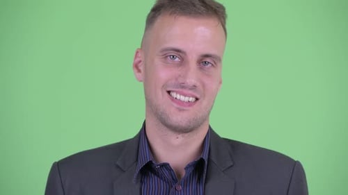 Smiling Man in Suit on Green Screen