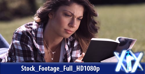 Woman Reading a Book on the Grass