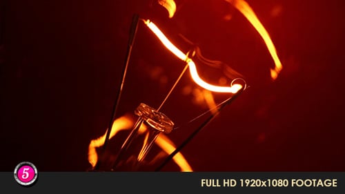 Illuminated Light Bulb Filament Macro Shot