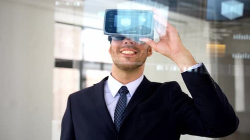 Smiling Man Uses VR Goggles in Bright Office
