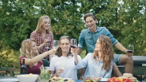Friends Toasting Wine at Outdoor Celebration