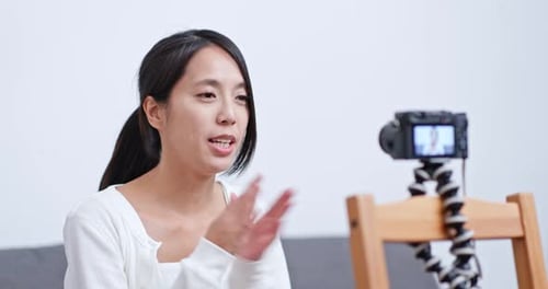 Young Adult Woman Vlogging and Talking to Camera