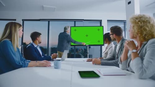 Business Professionals Meeting with Green Screen Presentation