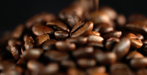 Close Up Footage of Coffee Beans Piling Up