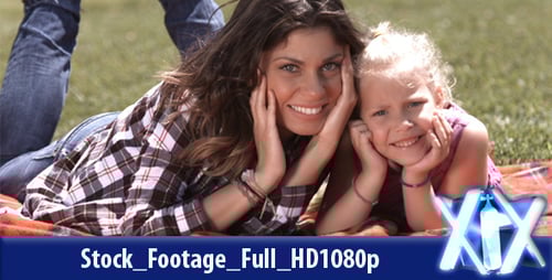 Woman and Girl Relaxing on Picnic Blanket