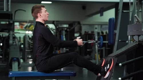 Man working out with equipment in gym