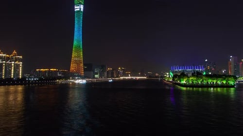 Guangzhou Night Business City Cityscape China Pearl River with Boats Traffic Timelapse Pan Up