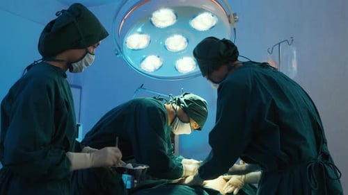 Doctors Performing Surgery in Operating Room