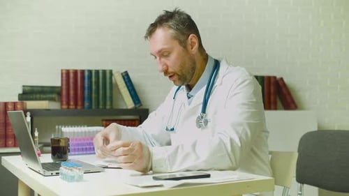 Burnout at Work the Doctor Takes Off His Glasses and Rubs the Bridge of His Nose