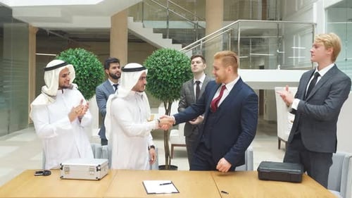 Meeting of International Business Partners in Office for Signing New Document.