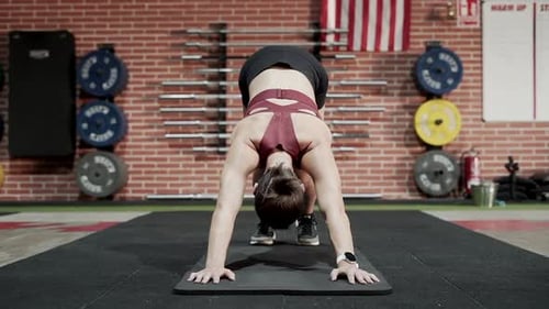 Sportswoman stretching in gym