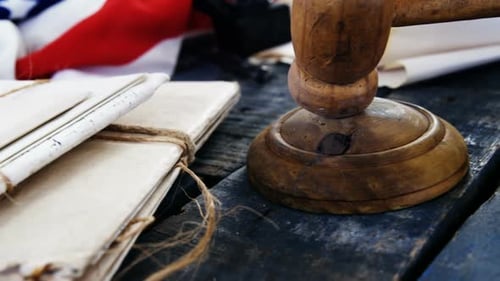 Gavel and legal documents arranged on American flag