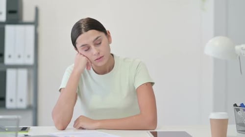 Tired Sleeping Young Latin Woman in Office